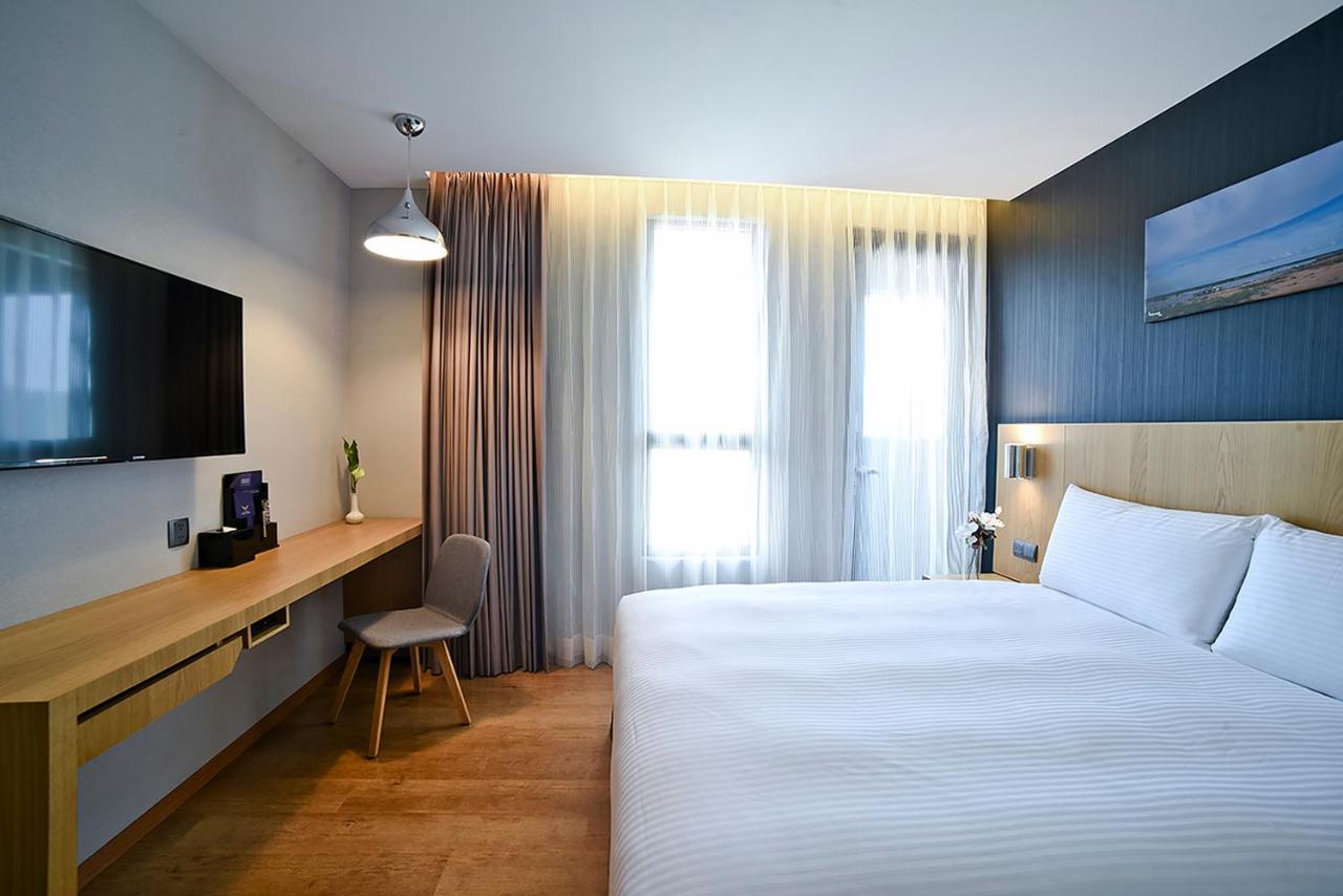 Yidear Hotel Синьчжуан Экстерьер фото